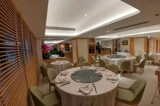 Tables and chairs inside Liu Yuan Pavillion