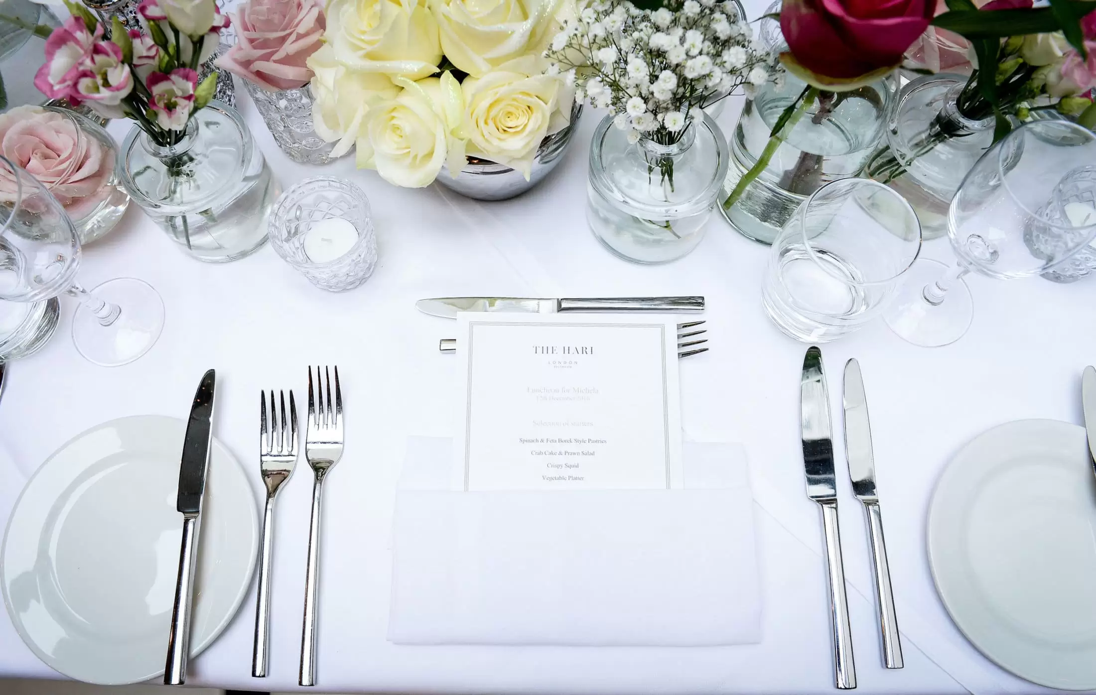 Table setting for event on Garden Terrace with flowers