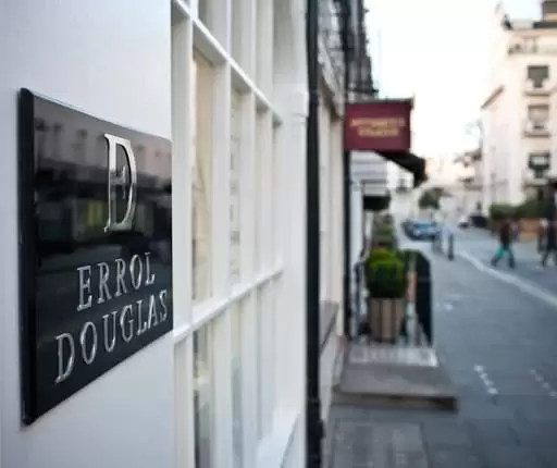 The wall plaque for the Errol Douglas Salon in Belgravia